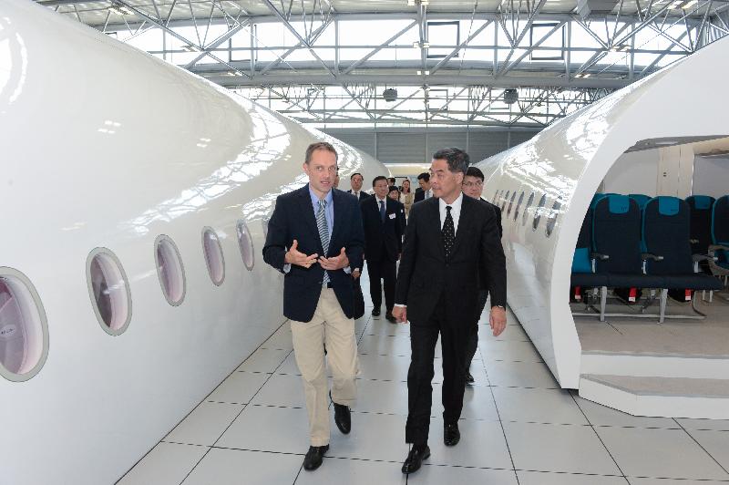 The Chief Executive, Mr C Y Leung (right), visits the mock-up centre at Airbus in Toulouse, France, today (June 7, Toulouse time). 